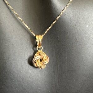 18Karat Gold Necklace and Pendant 
18 inches long , Knot pendant tri-color